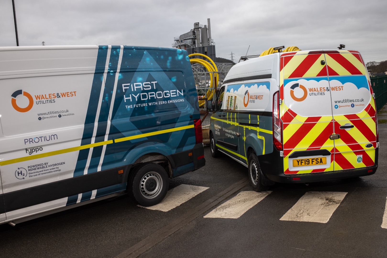 two hydrogen fuelled vans parked side by side